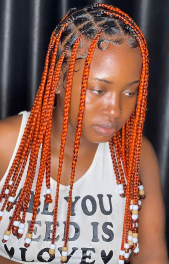 Orange Braided Hairstyle With Beads