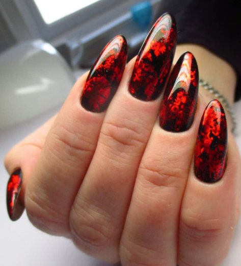 red and black design on nails