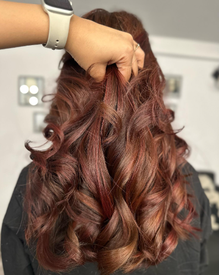 A Blend Of Brown Hair With Red Highlights