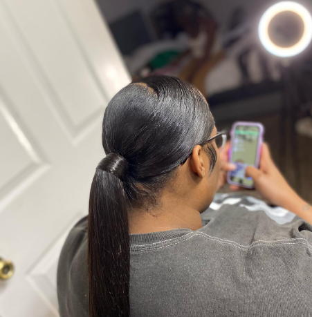 A Swoop Lower-Polished Black Ponytail Hairstyle