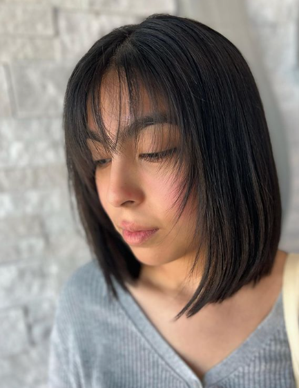 Curved Bob With Wispy Bangs Hairstyle