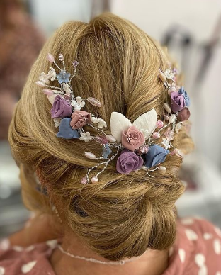 Floral Bow Style Bun Hairstyle For Wedding Guests