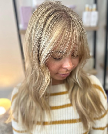 Golden Highlights Wispy Bangs Hairstyle