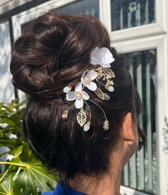 High Textured Bun Hairstyle For Wedding Guests