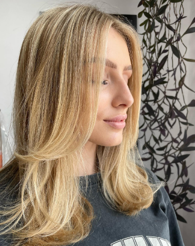 Layered With Glowing Honey Blonde Hair