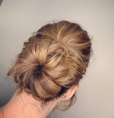 Messy Donut Bun Hairstyle For Wedding Guests