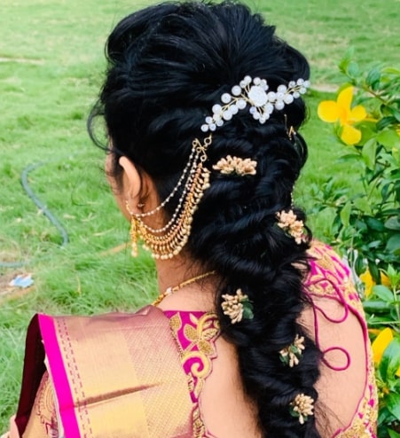 Messy Puff Braided with Flowers Hairstyle for Indian Wedding Function