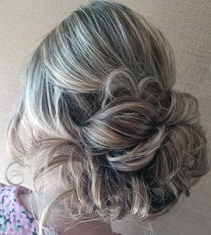 Messy Twisted Bun Hairstyle For Wedding Guests