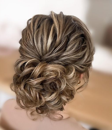 Messy Twisted Bun Hairstyle For Wedding Guests