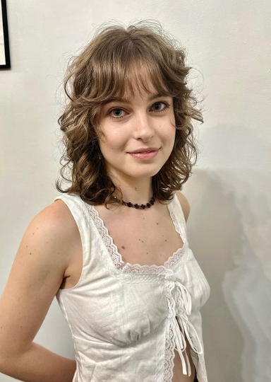Short Curly Bob With Wispy Bangs Hairstyle
