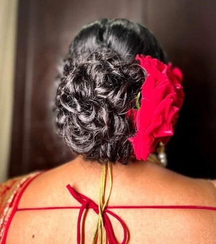 Simple Bun Covered with Red Roses 