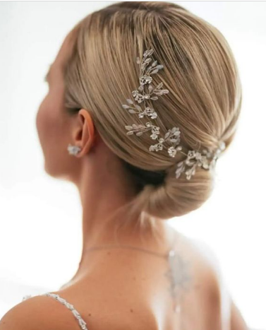 Simple Bun With Hair Accessories Hairstyle For Wedding Guests