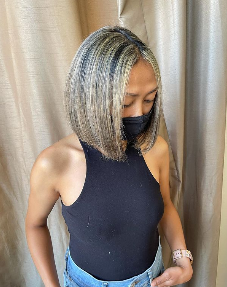 Sleek And Silver-Toned Highlights Middle Part Bob