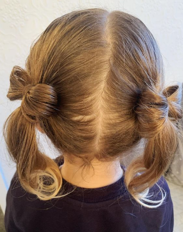 Teeny little bow pigtails Cute hairstyle for girls