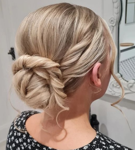 Twisted Low Bun Hairstyle For Wedding Guests