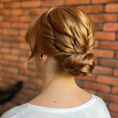 Twisted Low Bun Hairstyle For Wedding Guests