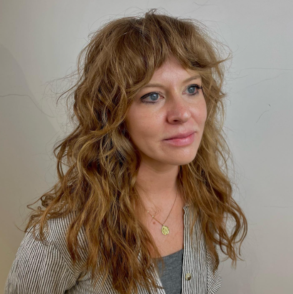 Wavy Curly Blonde Hairstyle With Bangs