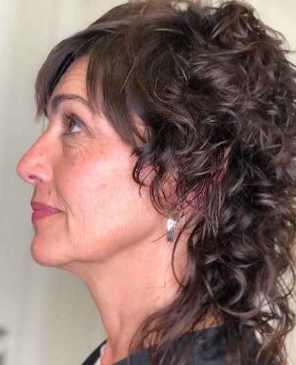 Curly Black Shaggy Hairstyle For Women Over 50