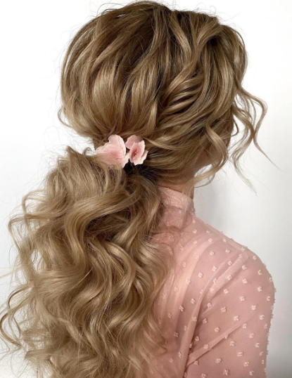 Curly Low Messy Ponytail Hairstyle