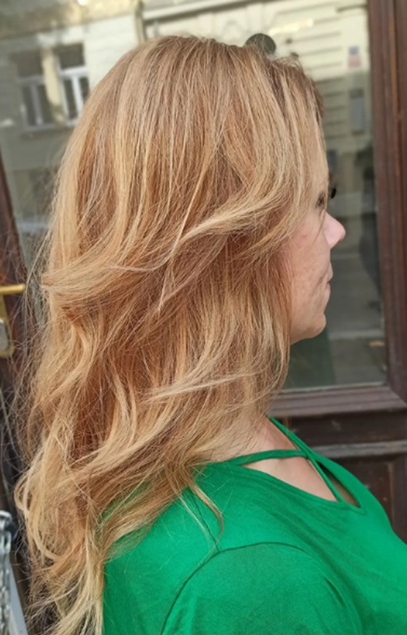 Golden Blonde Wavy Hairstyle For Women Over 50
