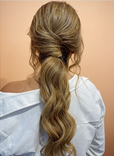 Honey Blonde Low Messy Ponytail Hairstyle