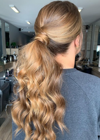 Light Brown Wavy Long Messy Ponytail Hairstyle