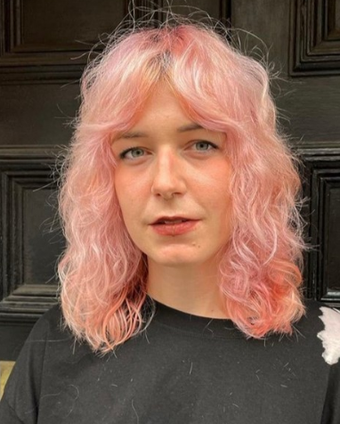 Pastel Pink Shaggy Hairstyle For Women Over 50