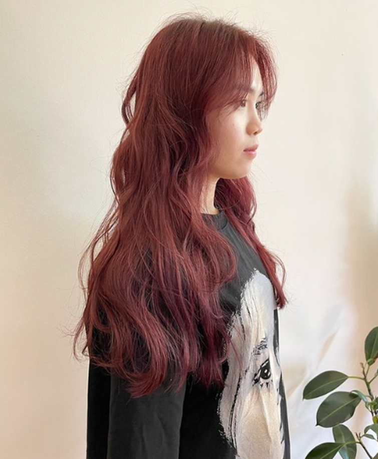 Red And Copper Colored Fluffy Wavy Long Layered Hairstyle