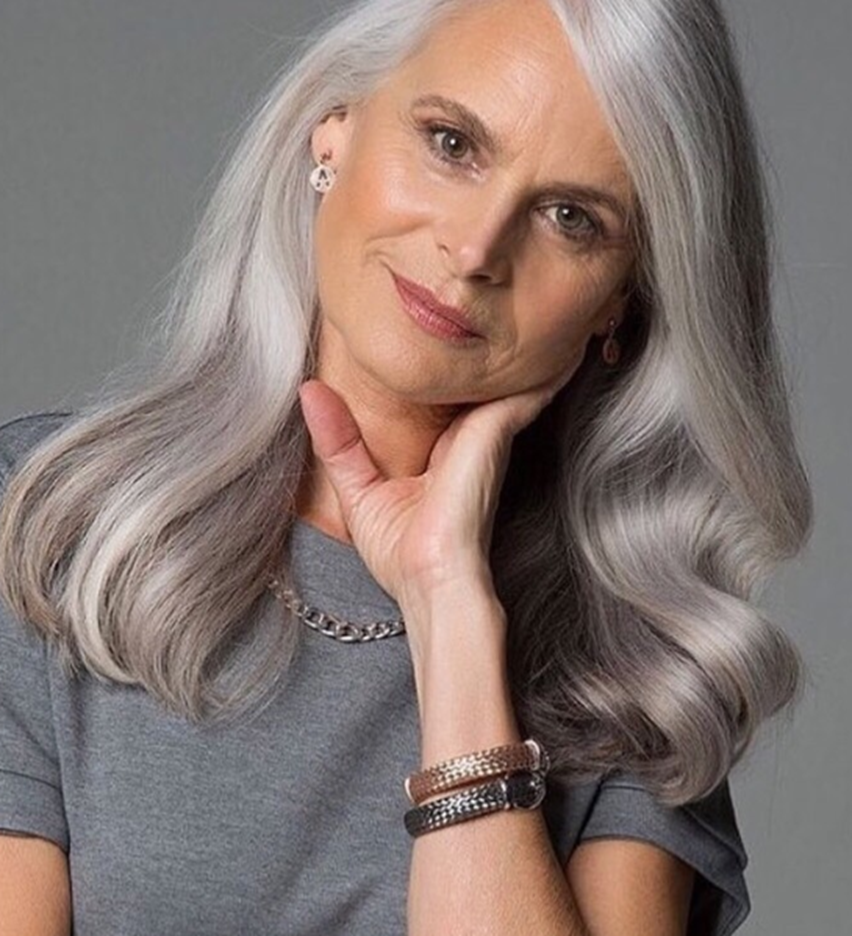 Smooth And Silver Colored Wavy Hairstyle For Women Over 50