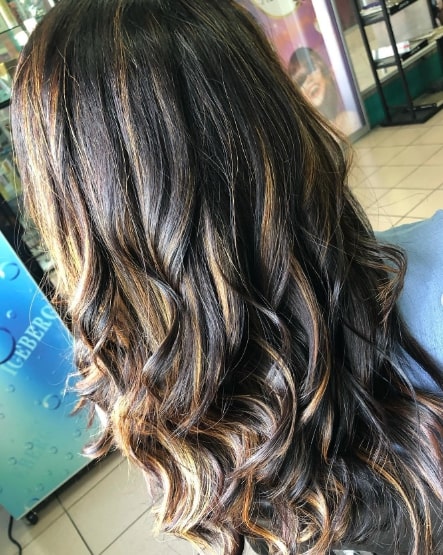 Tousled Waves Hairstyles With Caramel Highlights