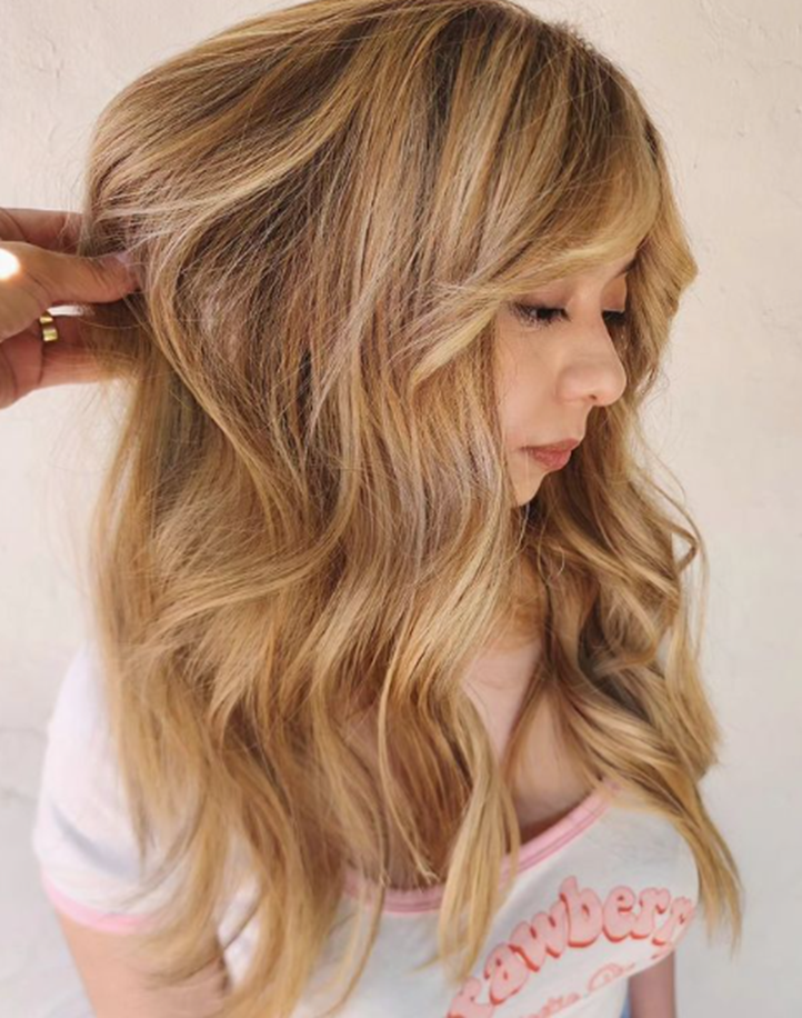 Wavy Blonde With Curtain Bangs Long Layered Hairstyle