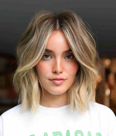 Honey Blonde Short Hairstyle With Highlight
