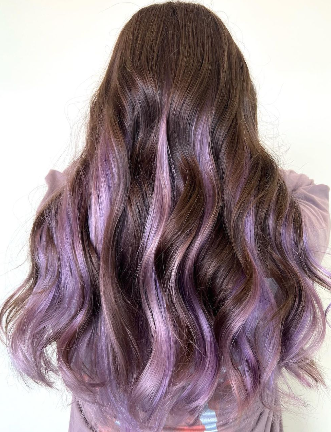Loose Curls With Purple Highlights In Brown Hair