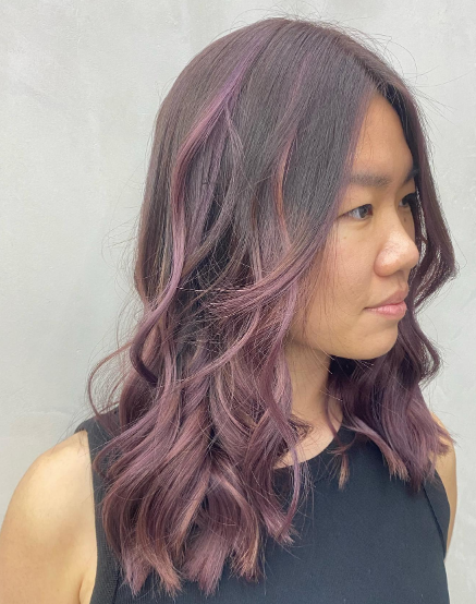 Short Wavy With Purple Highlights In Brown Hair